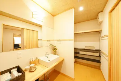 a bathroom with a sink and a mirror at YADOYA Uguisu in Tokyo