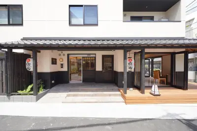a building with awning on the front of it at YADOYA Uguisu in Tokyo