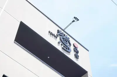 a sign on the side of a building at YADOYA Uguisu in Tokyo