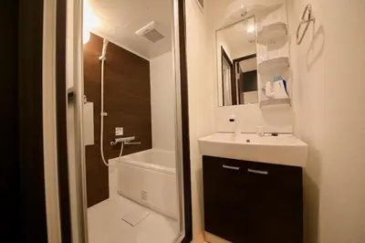 a bathroom with a sink and a toilet and a shower at CORDEA\u516b\u5e83 in Tokyo
