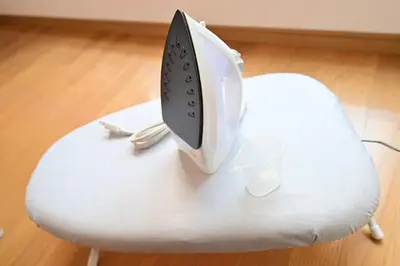a computer monitor sitting on top of a white stool at OMM STAY in Tokyo