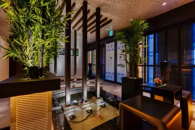a lobby with potted plants in a building at HOTEL Lotus Shibuya (Adult Only) in Tokyo