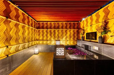a room with a wooden floor and yellow walls at HOTEL Lotus Shibuya (Adult Only) in Tokyo