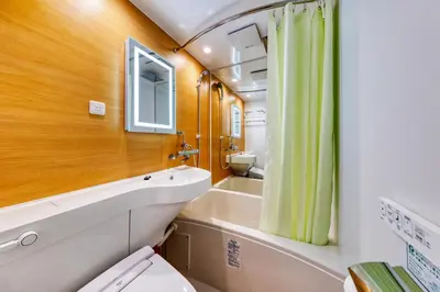 a bathroom with a toilet and a sink at HOTEL Lotus Shibuya (Adult Only) in Tokyo