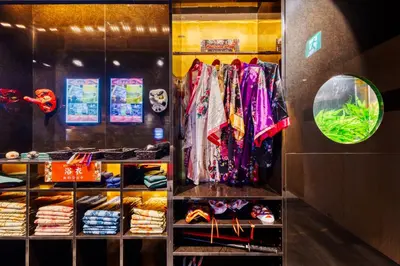a closet filled with lots of clothes at HOTEL Lotus Ikebukuro (Adult Only) in Tokyo
