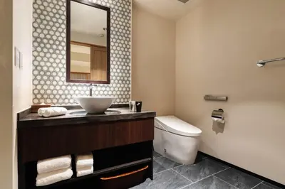 a bathroom with a sink and a toilet at PROSTYLE RYOKAN TOKYO ASAKUSA in Tokyo