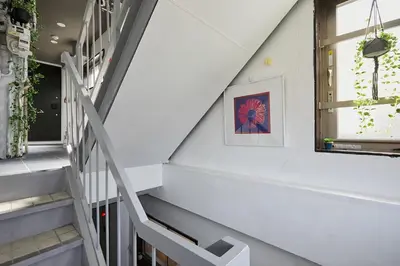 a staircase in a house with a window at Akabane TK Building 101 in Tokyo
