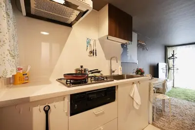 a small kitchen with a sink and a stove at Akabane TK Building 102 in Tokyo