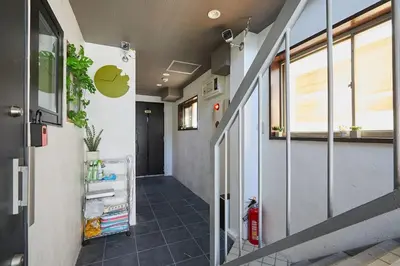 an office hallway with an apple logo on the wall at Akabane TK Building 203 in Tokyo