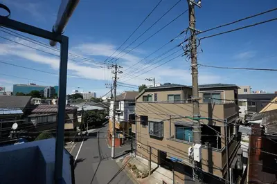 a view of a city street from a balcony at Akabane TK Building 301 in Tokyo