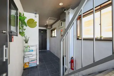 an office hallway with an apple logo on the wall at Akabane TK Building 301 in Tokyo