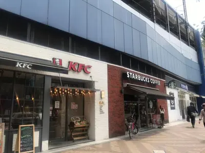 a kfc store on the side of a building at Akabane TK Building 301 in Tokyo