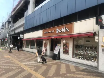 a man and two dogs walking in front of a store at Akabane TK Building 302 in Tokyo