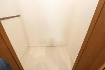 an empty room with a door and a wooden floor at Kamiya TK Building 201 in Tokyo