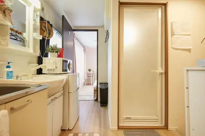 a kitchen with a sink and a microwave at Kamiya TK Building 203 in Tokyo