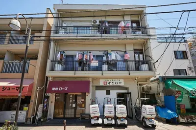a building with clothes hanging on a balcony at Kamiya TK Building 301 in Tokyo