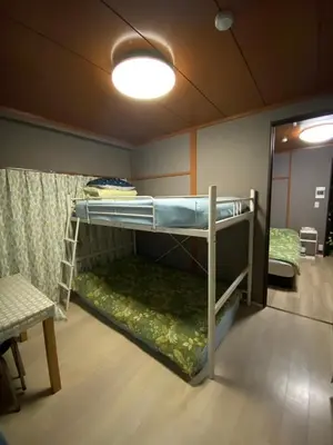 a bunk bed room with two bunk beds in it at Kamiya TK Building 302 in Tokyo