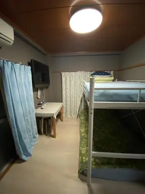 a room with a bunk bed and a table at Kamiya TK Building 302 in Tokyo