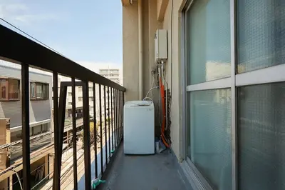 a balcony with a heater next to a window at Kamiya TK Building 302 in Tokyo