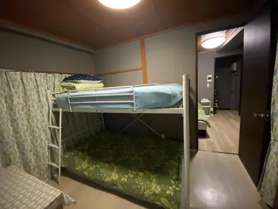 a room with a bunk bed and a hallway at Kamiya TK Building 302 in Tokyo