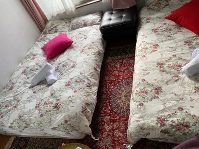 a bed in a room with a bed sidx sidx sidx at Takemura Building 301 in Tokyo