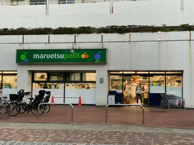 a man standing in front of a store at Takemura Building 301 in Tokyo