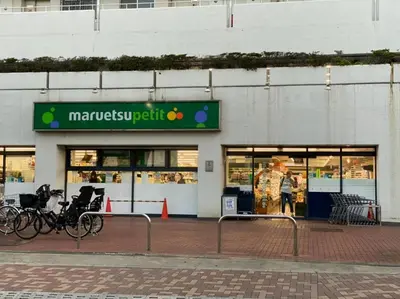 a man standing in front of a store at Takemura Building 302 in Tokyo