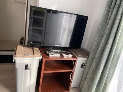 a flat screen tv sitting on top of a table at Takemura Building 302 in Tokyo