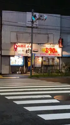 a crosswalk with a traffic light and a building at Takemura Building 104 in Tokyo