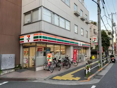 two bikes parked in front of a building at Takemura Building 104 in Tokyo