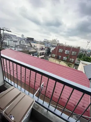 a dog standing on the roof of a building at Takemura Building 3F in Tokyo