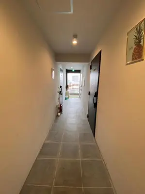 a hallway in a house with a tile floor at Takemura Building 3F in Tokyo