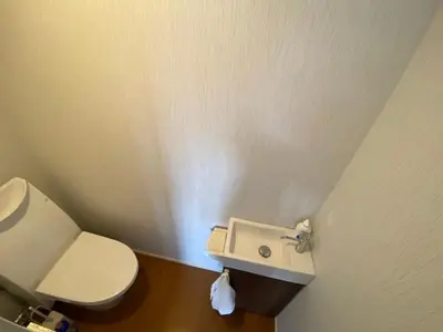 a bathroom with a toilet and a sink at Takemura Building 305 in Tokyo