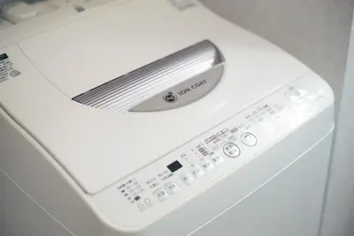 a white washing machine with a control panel at NorthRiverSKY in Tokyo