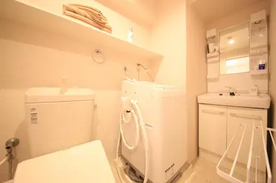 a small bathroom with a toilet and a sink at NorthRiverSKY in Tokyo
