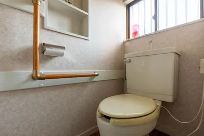 a bathroom with a toilet and a window at Shinjuku Japanese-style two storey house in Tokyo