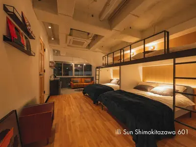 a bedroom with two bunk beds and a couch at illi Sun Shimokitazawa in Tokyo