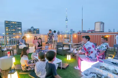a group of people sitting on a roof at Petit Grande Miyabi in Tokyo