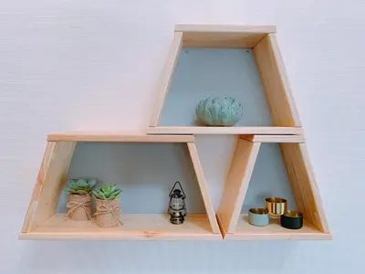 a wooden shelf with some plants and a vase at Dash Living Higashi Azabu in Tokyo