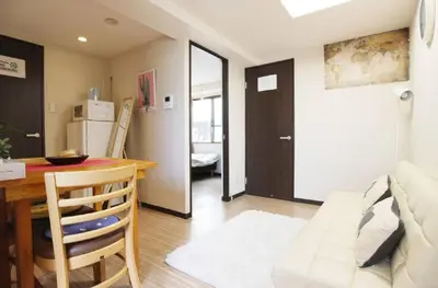 a kitchen and dining room with a table and a dining room at Cozy room in Itabashi in Tokyo