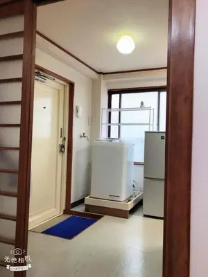 an empty kitchen with a refrigerator and a window at Cozy room in Itabashi in Tokyo