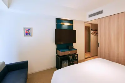 a hotel room with a bed and a tv at NOHGA HOTEL AKIHABARA TOKYO in Tokyo