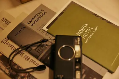 a pair of scissors sitting on top of a pile of books at NOHGA HOTEL AKIHABARA TOKYO in Tokyo