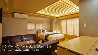 a hotel room with a bed and a couch at Stay SAKURA Tokyo Shinjuku Hyakukura in Tokyo