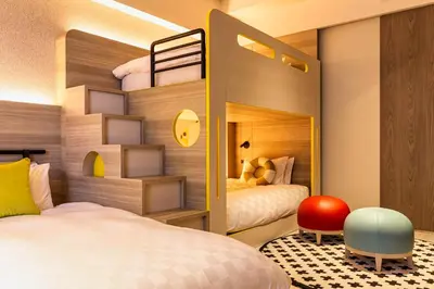 a bedroom with two beds and a bunk bed at Tokyo Bay Shiomi Prince Hotel in Tokyo