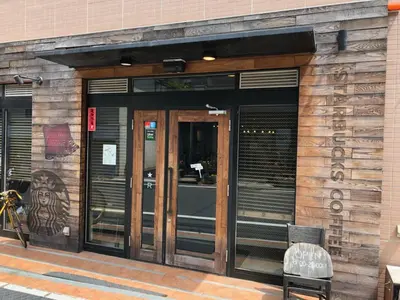an entrance to a building with a revolving door at COTO Tokyo Shibuya 7 in Tokyo
