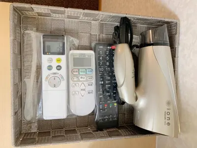 a plastic container filled with different types of electronics at Allcomein Hotel Akihabara in Tokyo