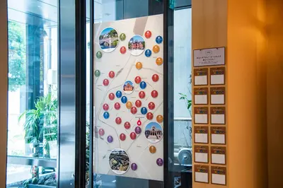 a wall with stickers on it in a building at Agora Tokyo Ginza in Tokyo