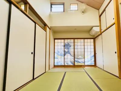 an empty room with doors and a window at Hao Bros. Home \u548c(WA) in Tokyo