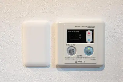 an air monitor is attached to a wall at Higashi Shinagawa Apartment by Tranova in Tokyo